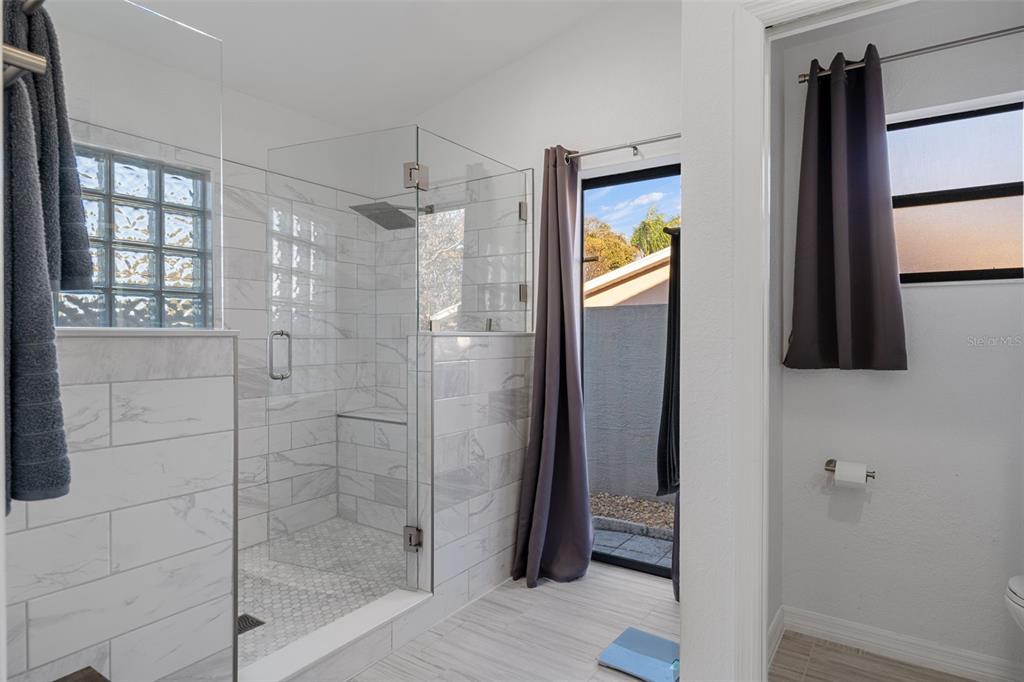 10918 Midland Bridge Road Hudson, FL 34667 - Photo 21 of 42 a bathroom with a shower and a sink