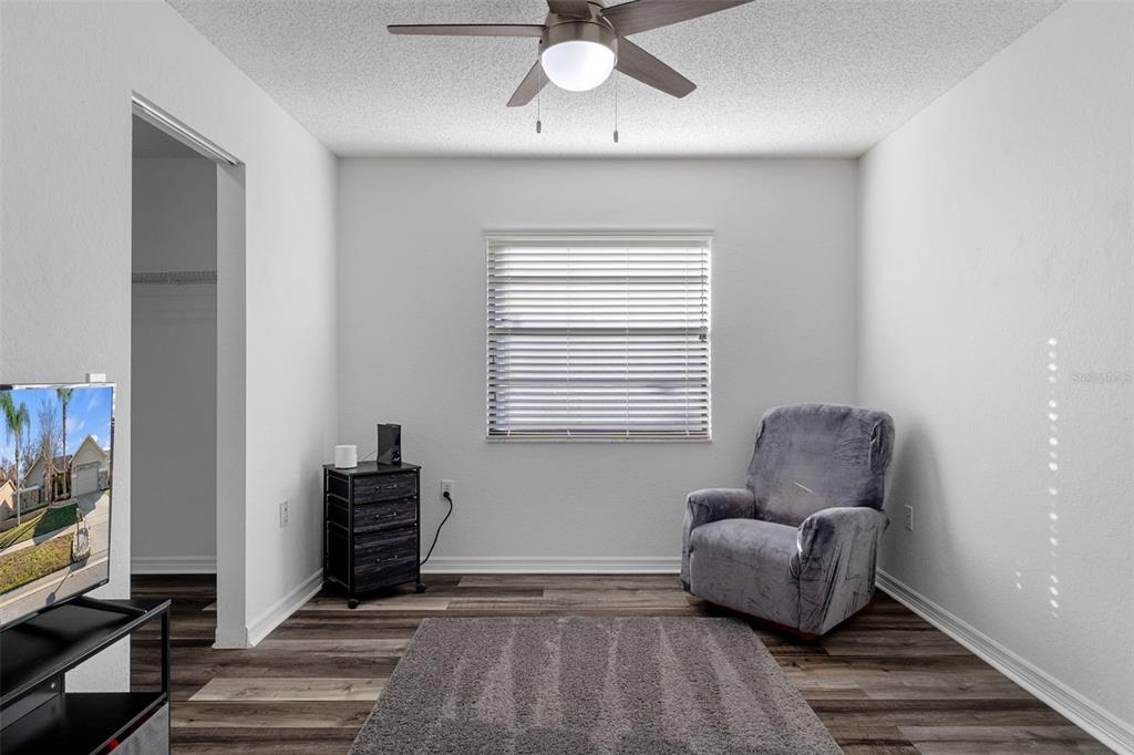 10918 Midland Bridge Road Hudson, FL 34667 - Photo 28 of 42 a living room with furniture and a window