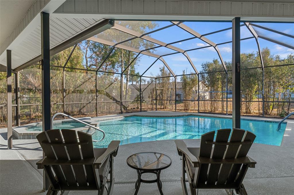 10918 Midland Bridge Road Hudson, FL 34667 - Photo 32 of 42 a view of a dining room with furniture wooden floor and a potted plant