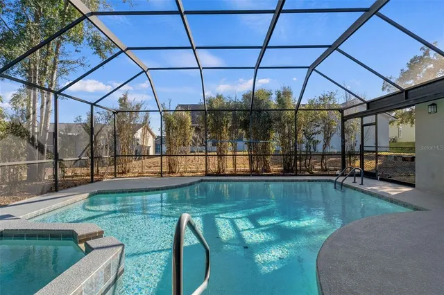 a view of a swimming pool with a patio