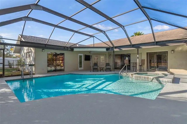 a view of a swimming pool with a patio