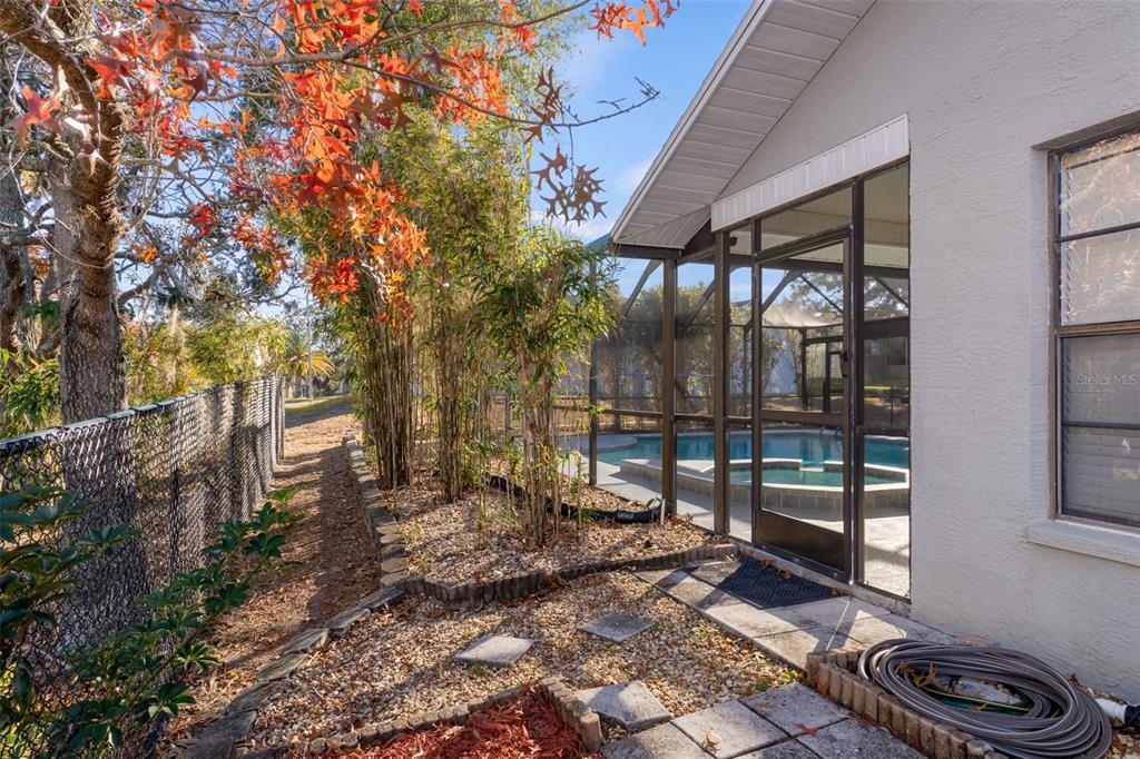 10918 Midland Bridge Road Hudson, FL 34667 - Photo 41 of 42 a garden view with a seating space