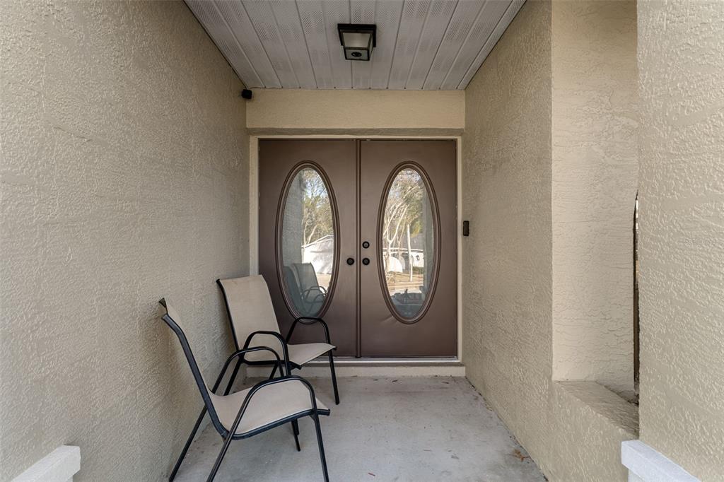 10918 Midland Bridge Road Hudson, FL 34667 - Photo 6 of 42 a view of a livingroom with furniture and mirror
