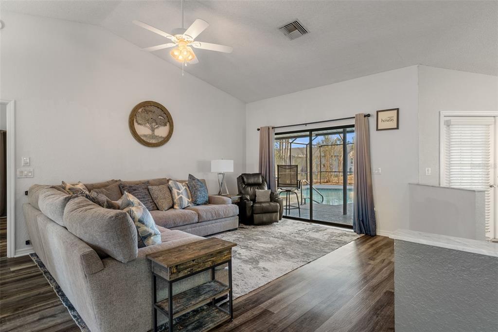 10918 Midland Bridge Road Hudson, FL 34667 - Photo 7 of 42 a living room with furniture and a window