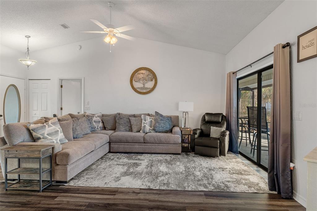 10918 Midland Bridge Road Hudson, FL 34667 - Photo 8 of 42 a living room with furniture and a window