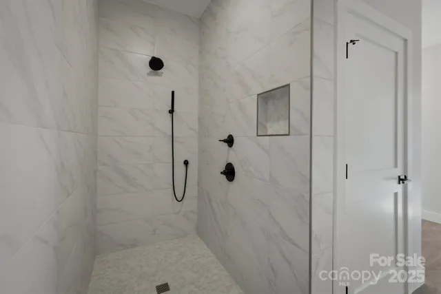 a bathroom with double vanity sink and mirror