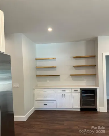 a view of cabinets and wooden floor