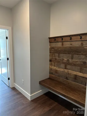 a view of room with wooden floor