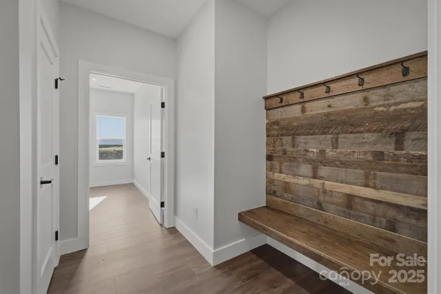 a balcony with furniture and some potted plants