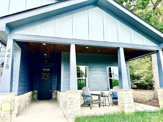 a view of a chair and tables in the balcony