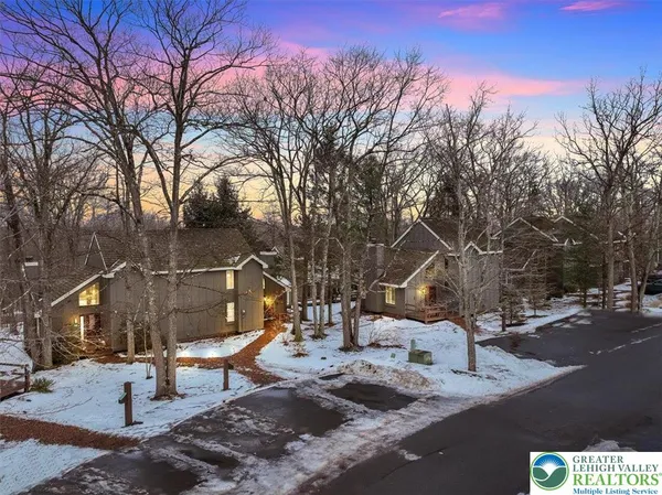 a view of a park with iron fence