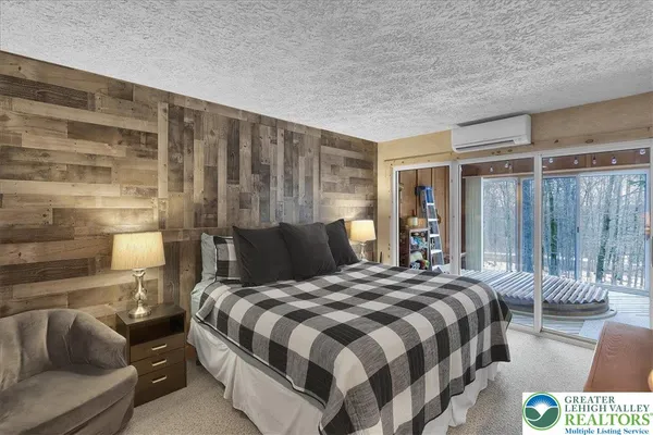 a bedroom with a bed and a couch