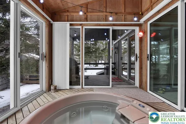 a view of a living room and a balcony