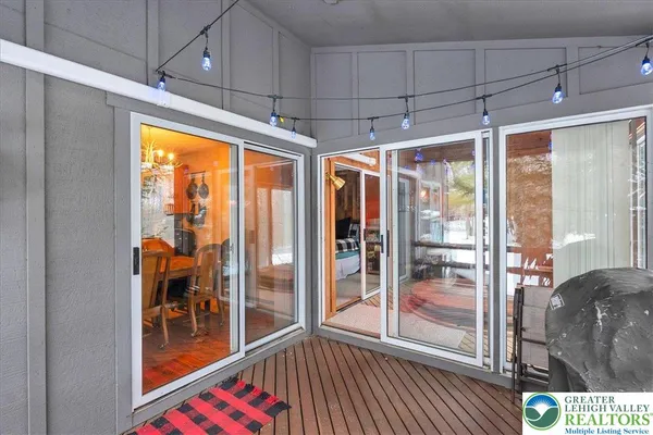 a bedroom with a bed and dresser with mirror