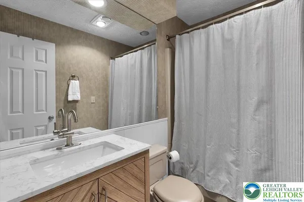 a bedroom with two beds and a window