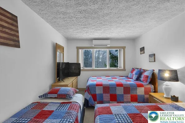 a bed room with a bed and a window