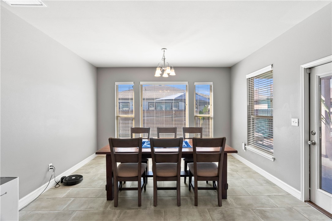 1815 Monterey Bay Drive Portland, TX 78374 - Photo 15 of 38 a dining room with furniture and window