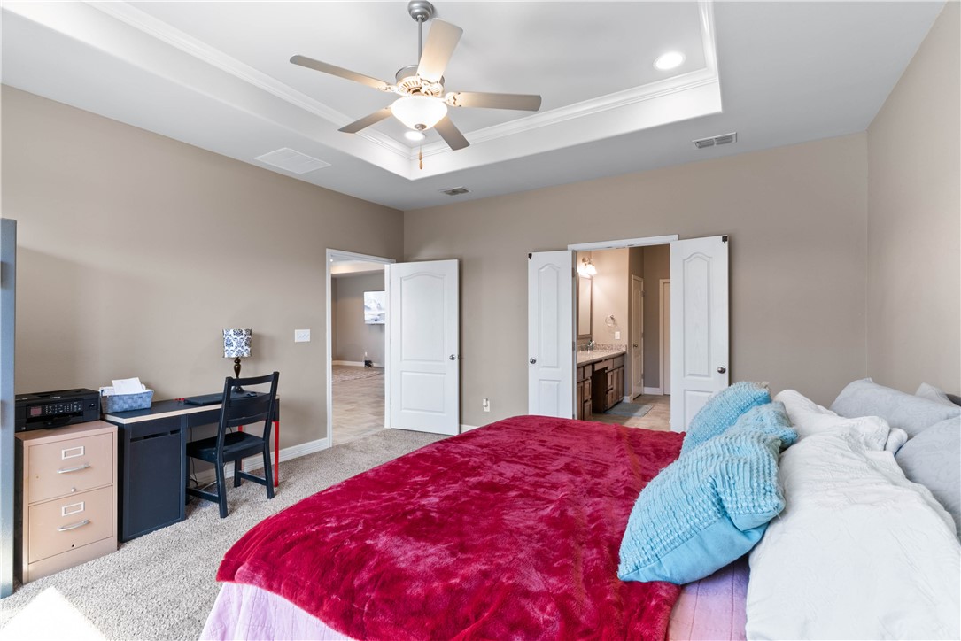 1815 Monterey Bay Drive Portland, TX 78374 - Photo 17 of 38 a bed room with a bed and a chandelier