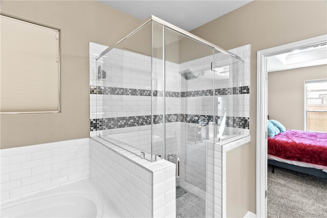 1815 Monterey Bay Drive Portland, TX 78374 - Photo 20 of 38 a en suite bathroom with a tub and shower
