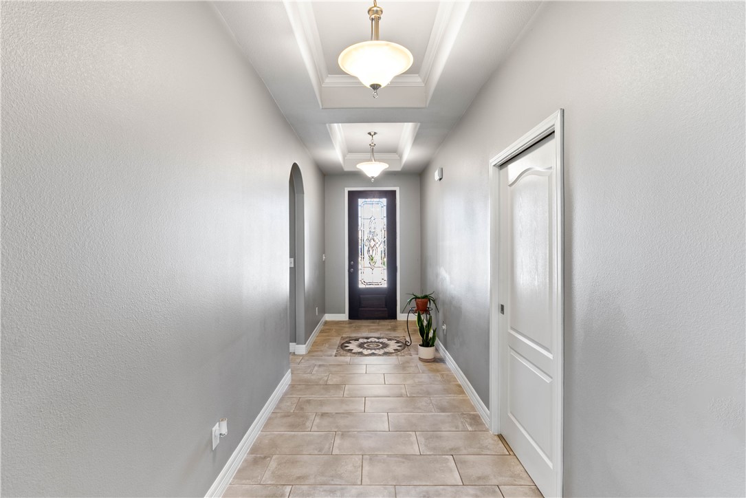 1815 Monterey Bay Drive Portland, TX 78374 - Photo 7 of 38 a view of a hallway with a chandelier
