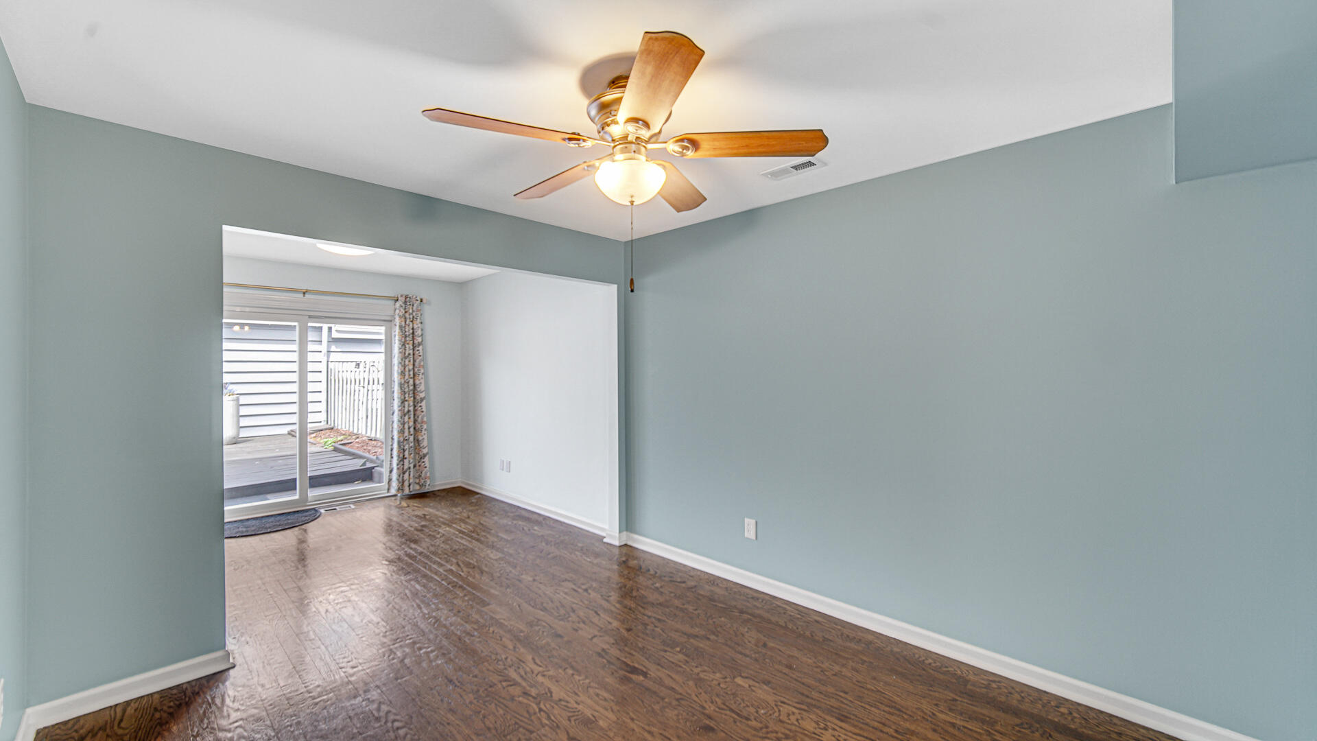 771 Kenmare Parkway Crown Point, IN 46307 - Photo 8 of 20 a view of an empty room with window and wooden floor