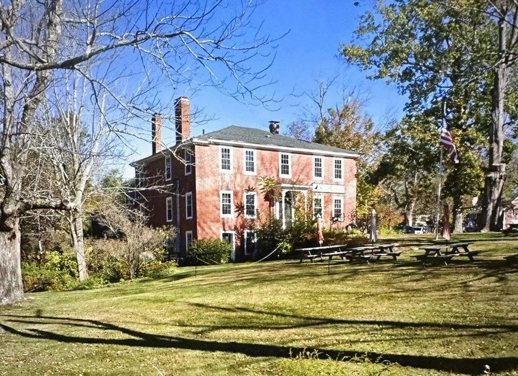 a view of swimming pool with large trees