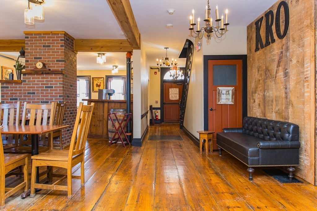 10 Baldwinville Road Templeton, MA 01468 - Photo 17 of 35 a living room with furniture a dining table and a chandelier