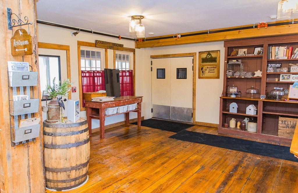 10 Baldwinville Road Templeton, MA 01468 - Photo 18 of 35 a living room with fireplace furniture and a book shelf