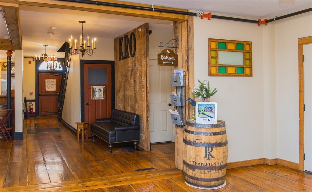 10 Baldwinville Road Templeton, MA 01468 - Photo 19 of 35 a living room with furniture and a chandelier
