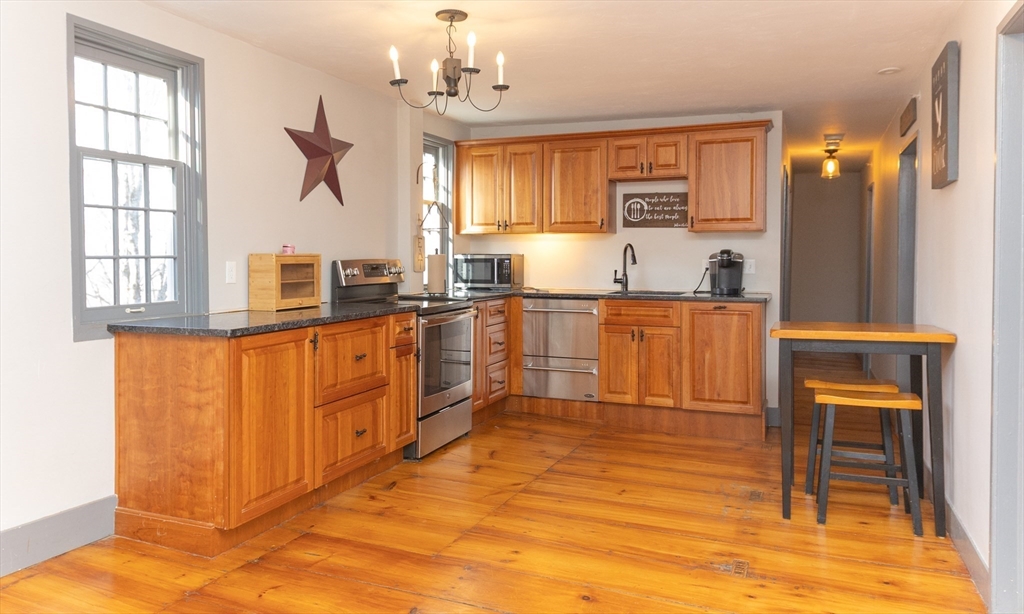10 Baldwinville Road Templeton, MA 01468 - Photo 20 of 35 a kitchen with stainless steel appliances granite countertop a stove a sink and a refrigerator