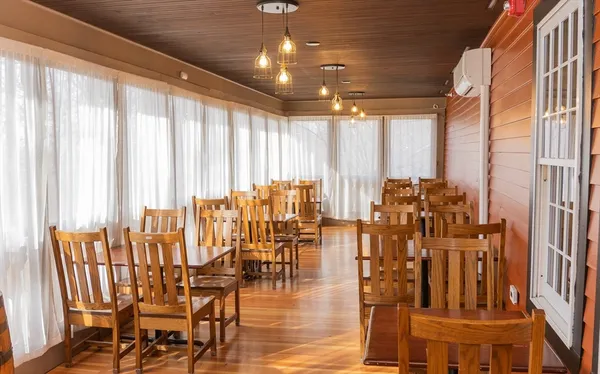 a view of a livingroom with furniture water view and a large window
