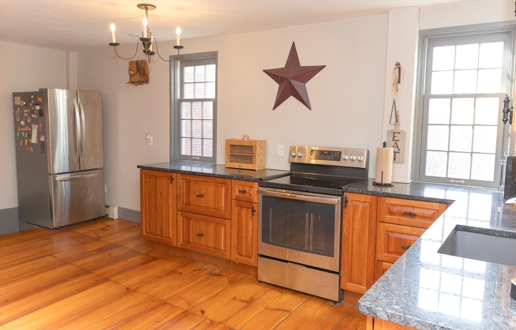 10 Baldwinville Road Templeton, MA 01468 - Photo 3 of 35 a kitchen with stainless steel appliances granite countertop a refrigerator a stove a sink and a window