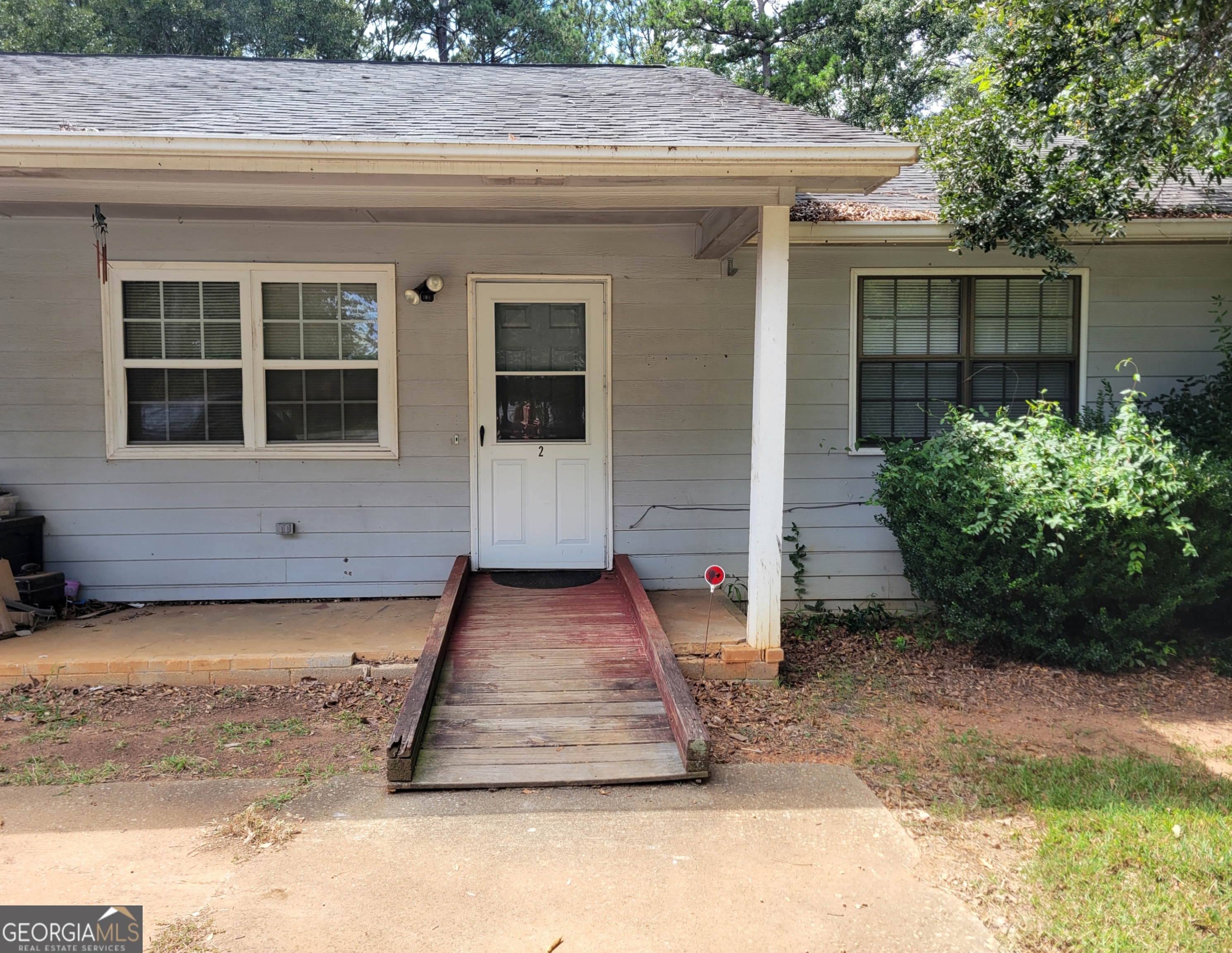 8 Candlewood Terrace Northeast, Unit 2 Winder, GA 30680 - Photo 8 of 8 a front view of a house with garden