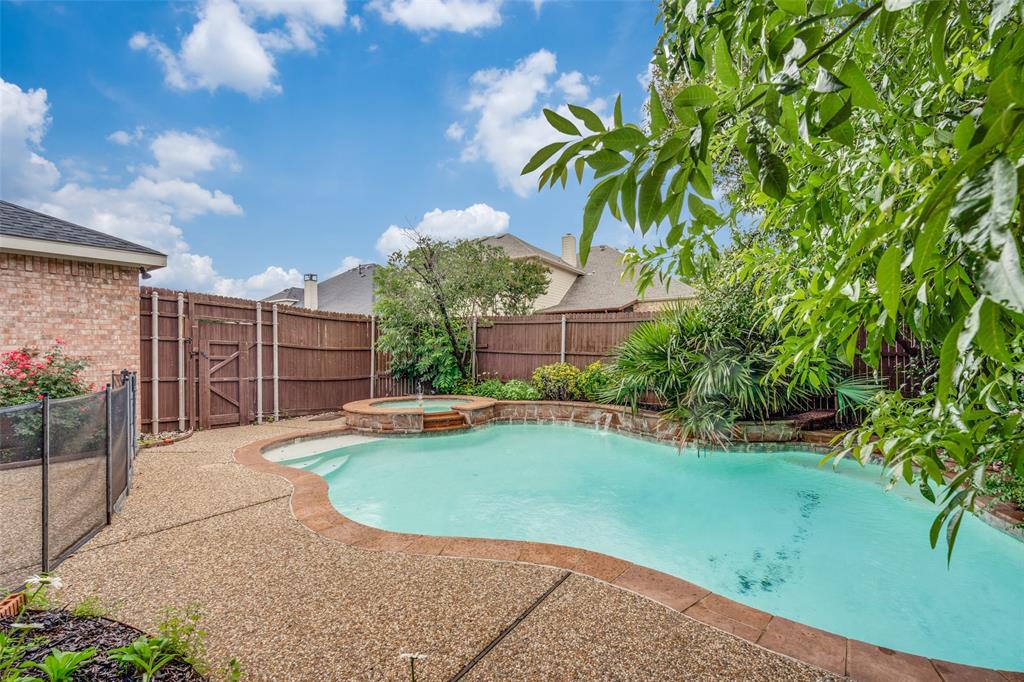 3421 Neiman Road Plano, TX 75025 - Photo 1 of 40 View of swimming pool with a fenced backyard and a pool with connected hot tub