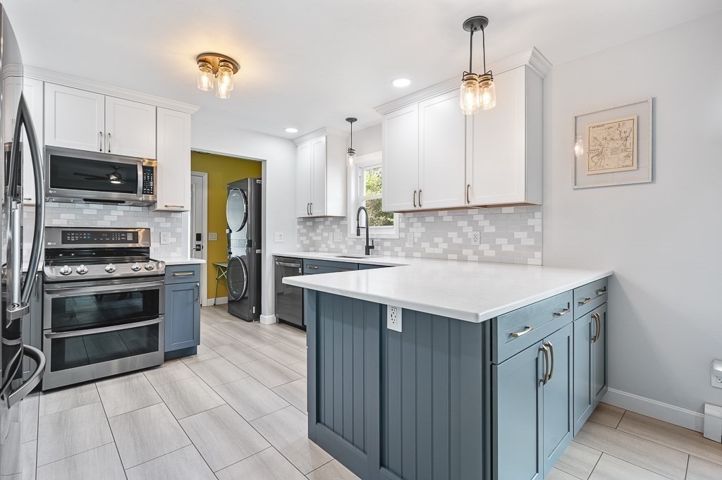 a kitchen with a sink stove and refrigerator