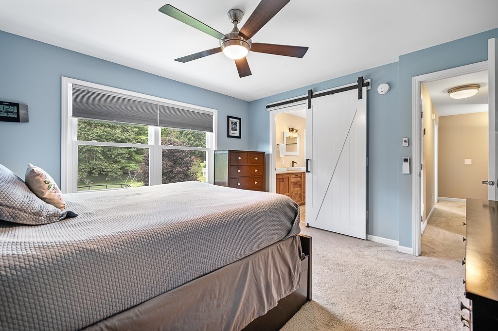6 Edward Road Dudley, MA 01571 - Photo 15 of 28 a bedroom with a large bed and a large window