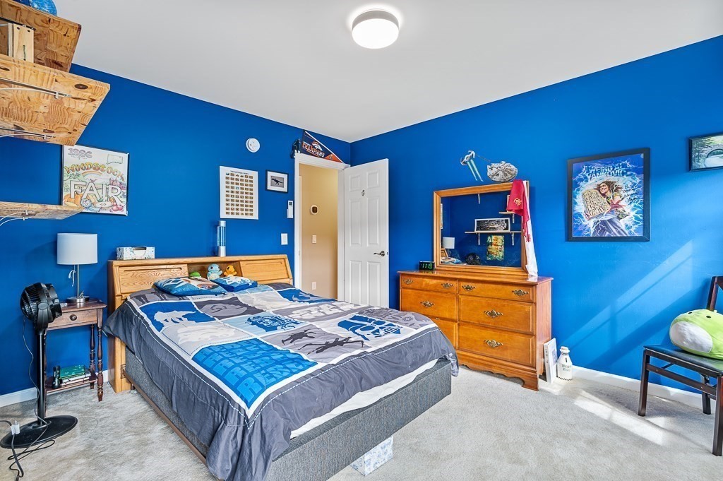 6 Edward Road Dudley, MA 01571 - Photo 19 of 28 a bedroom with a bed and a dresser in it