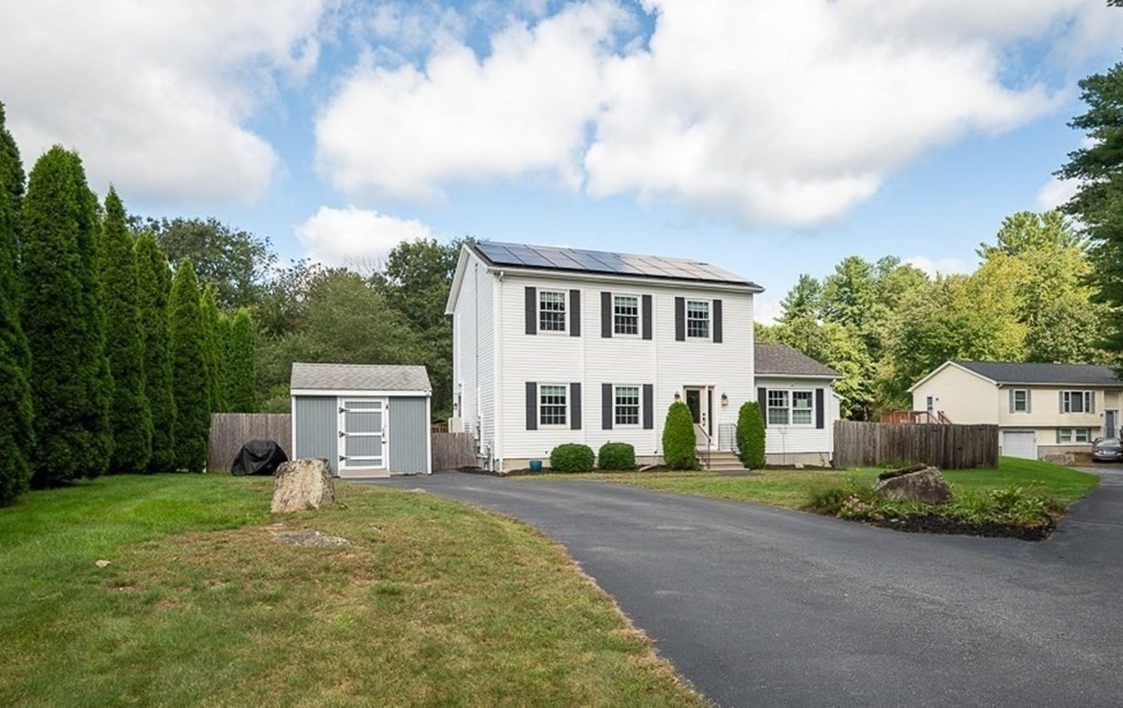 6 Edward Road Dudley, MA 01571 - Photo 2 of 28 a front view of a house with garden