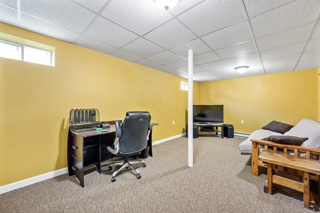 6 Edward Road Dudley, MA 01571 - Photo 24 of 28 a view of a workspace with furniture and a window
