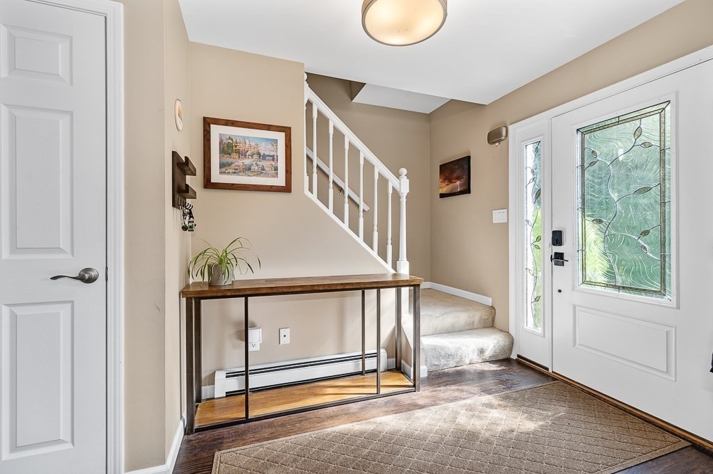 6 Edward Road Dudley, MA 01571 - Photo 4 of 28 a view of a livingroom with furniture and floor to ceiling window