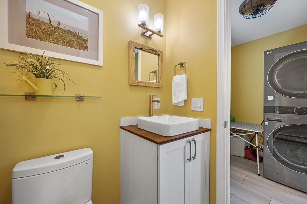 6 Edward Road Dudley, MA 01571 - Photo 9 of 28 a bathroom with a toilet a sink and a mirror