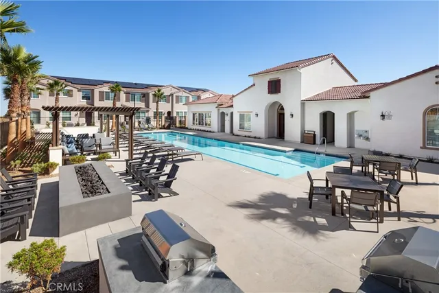 a front view of a house with yard and seating area