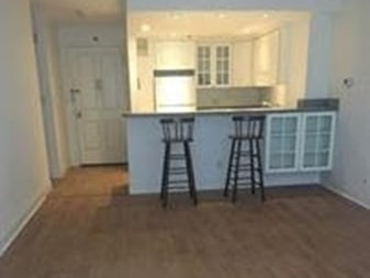 151 Tremont Street, Unit 7B Boston, MA 02111 - Photo 5 of 14 a view of an empty room with a window