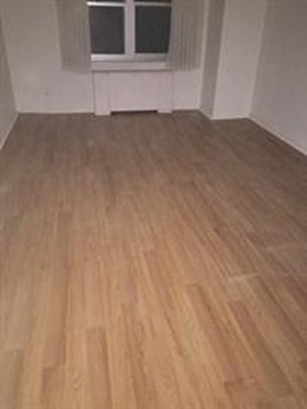 151 Tremont Street, Unit 7B Boston, MA 02111 - Photo 6 of 14 a view of an empty room with a window