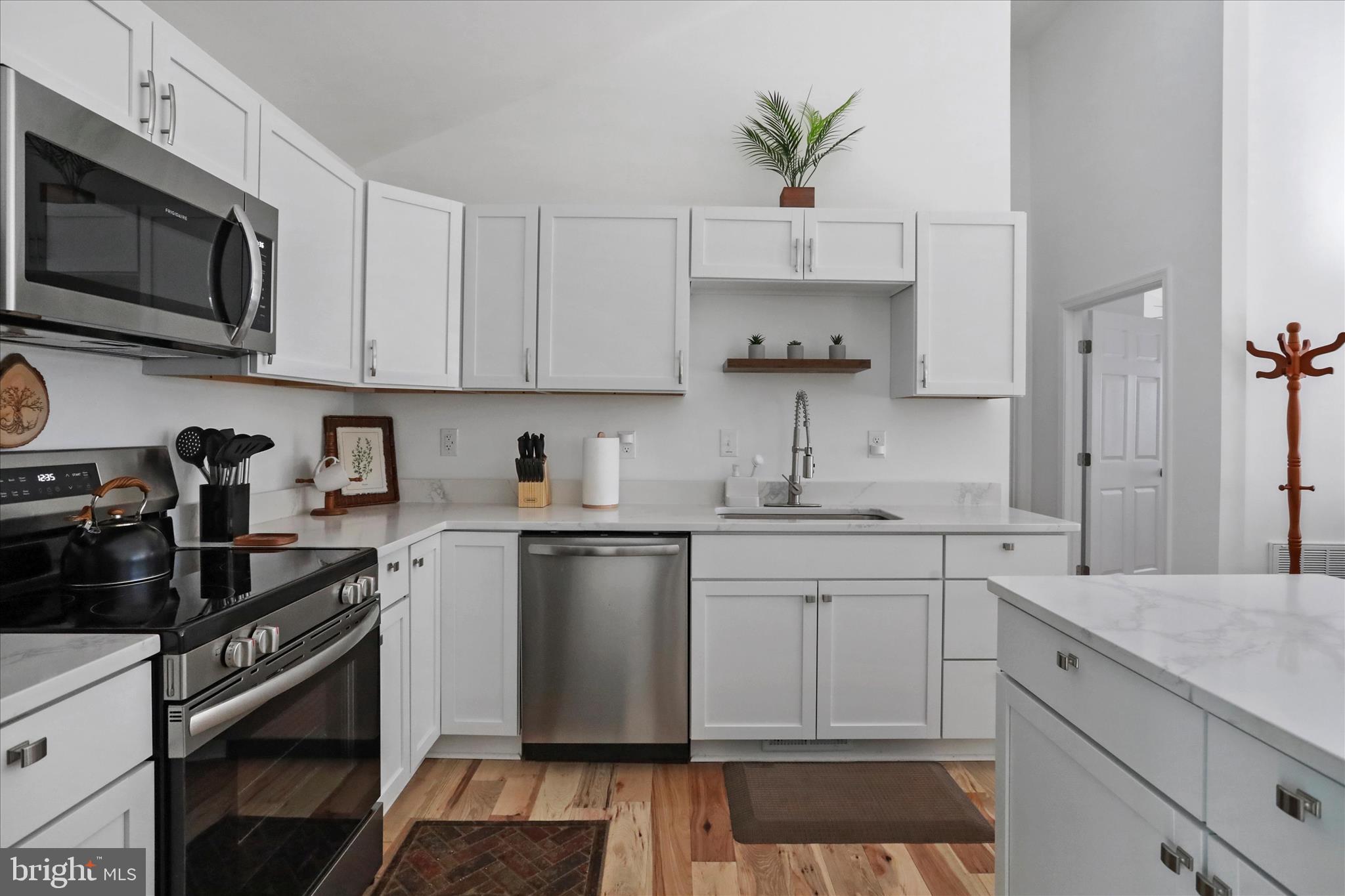 598 Crabapple Road Mount Jackson, VA 22842 - Photo 17 of 32 a kitchen with stainless steel appliances granite countertop a sink a stove a microwave and cabinets