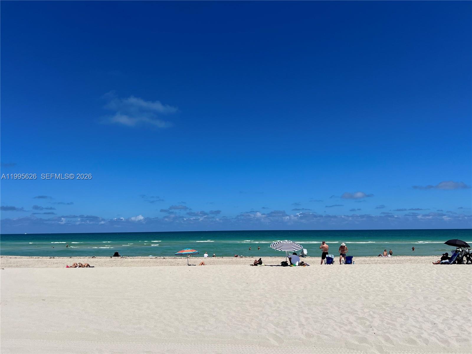 330 74th Street, Unit 5 Miami Beach, FL 33141 - Photo 13 of 19 a view of a swimming pool and an outdoor seating