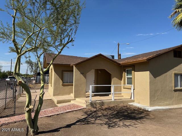 1000 East Garfield Street Phoenix, AZ 85006 - Photo 1 of 12 a front view of a house with a yard