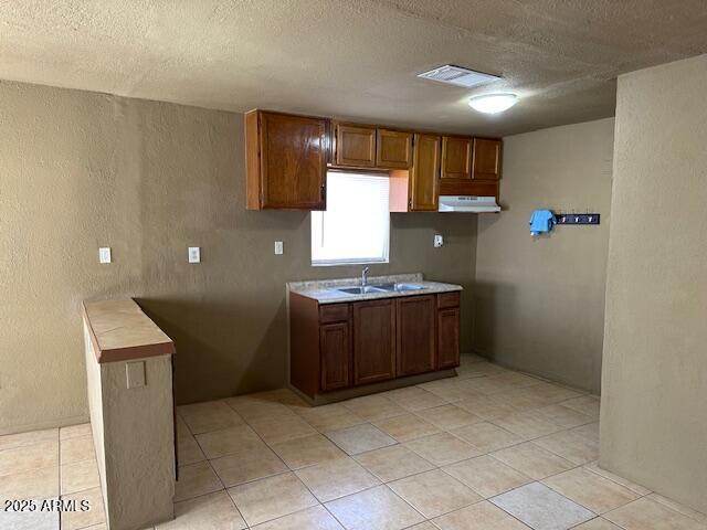 1000 East Garfield Street Phoenix, AZ 85006 - Photo 12 of 12 a kitchen with a refrigerator and a stove top oven