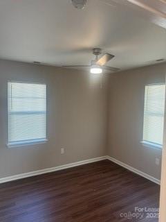 939 Matthews School Road Matthews, NC 28105 - Photo 12 of 21 a view of an empty room with wooden floor and a window