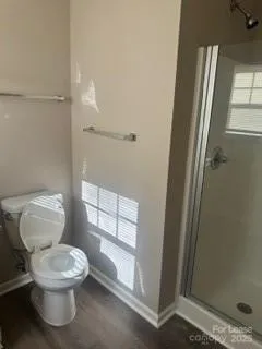 a white toilet sitting next to a bathroom sink
